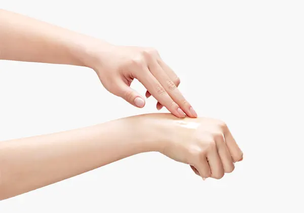 REJURAN Rebalancing Toner 120ml / 4.05 fl. oz. Korea Beauty For You A woman gently wiping the back of her hand with a cotton pad soaked in soothing PDRN toner for texture refining.